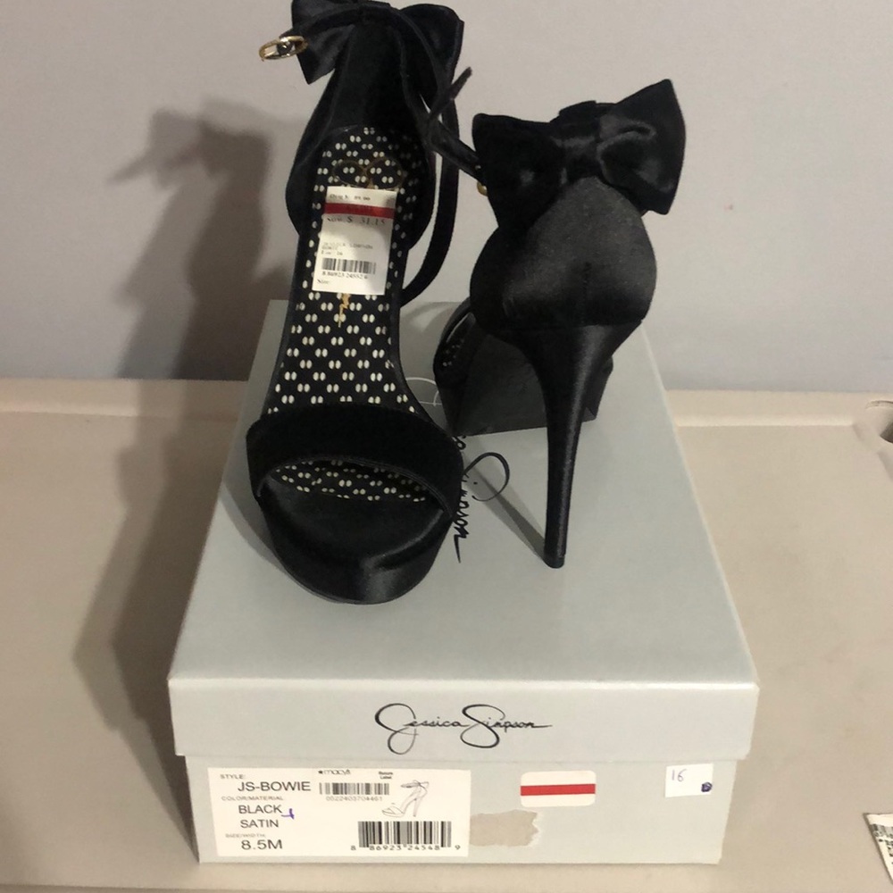 Black Satin Jessica Simpson high heeled sandal.